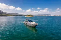 2016 Pershing 82 yacht cruising on a serene blue sea under a clear sky.