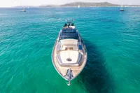 Luxurious 2016 Pershing 82 yacht cruising in clear turquoise waters.