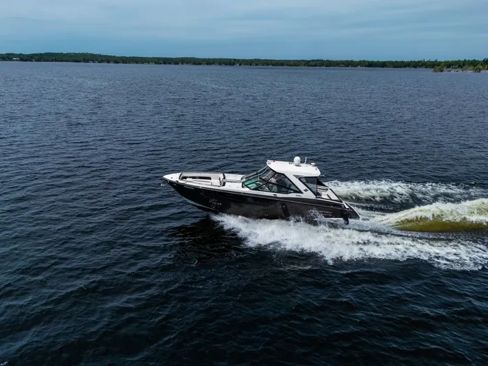  Yacht Photos Pics 2017 Monterey 378 Super Express cruising on a serene lake.