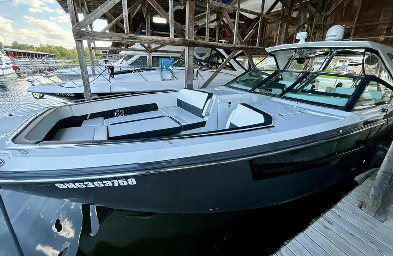  Yacht Photos Pics 2017 Monterey 378 Super Express boat docked in a marina under wooden shelter.