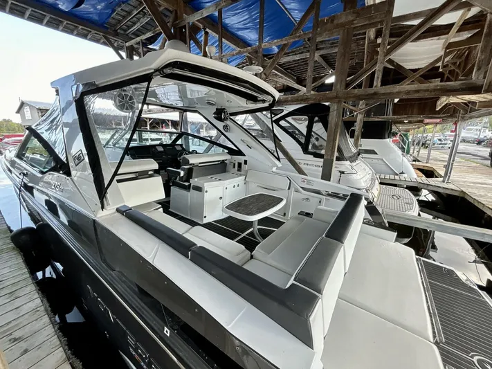  Yacht Photos Pics 2017 Monterey 378 Super Express boat docked under wooden shelter.