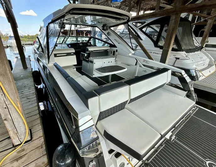  Yacht Photos Pics 2017 Monterey 378 Super Express boat docked, featuring spacious seating and sleek design.