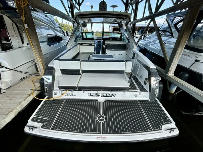  Yacht Photos Pics 2017 Monterey 378 Super Express boat docked, rear view with seating and deck.