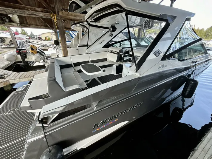  Yacht Photos Pics 2017 Monterey 378 Super Express boat docked, featuring sleek design and spacious seating area.