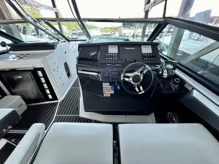  Yacht Photos Pics 2017 Monterey 378 Super Express boat cockpit with modern controls and steering wheel.
