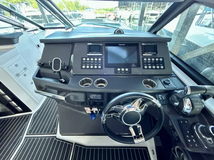  Yacht Photos Pics Cockpit of 2017 Monterey 378 Super Express with modern controls and steering wheel.