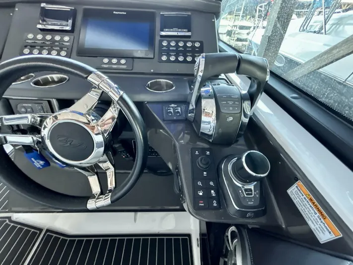  Yacht Photos Pics Cockpit of 2017 Monterey 378 Super Express with steering wheel and control panel.