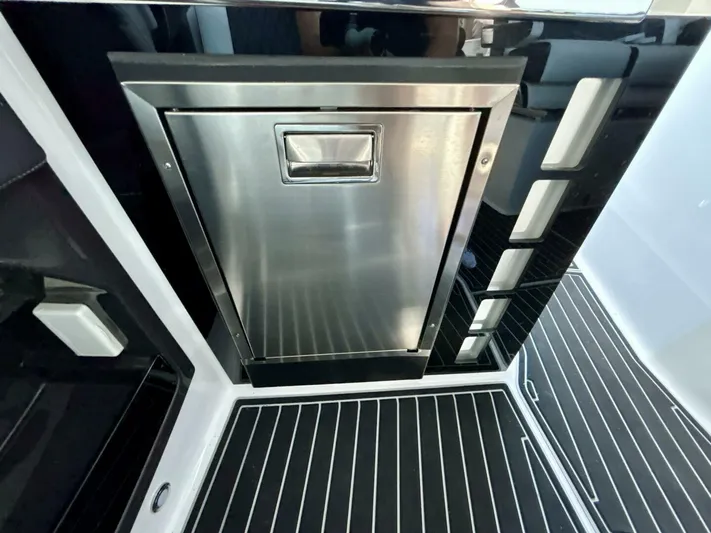  Yacht Photos Pics Stainless steel appliance on 2017 Monterey 378 Super Express yacht with sleek black interior.