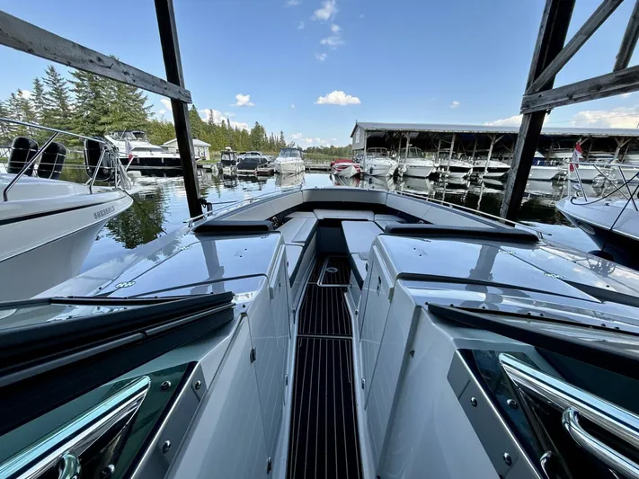  Yacht Photos Pics 2017 Monterey 378 Super Express docked at a marina, surrounded by other boats.