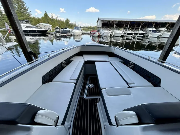  Yacht Photos Pics 2017 Monterey 378 Super Express boat interior at marina, featuring spacious seating and sleek design.