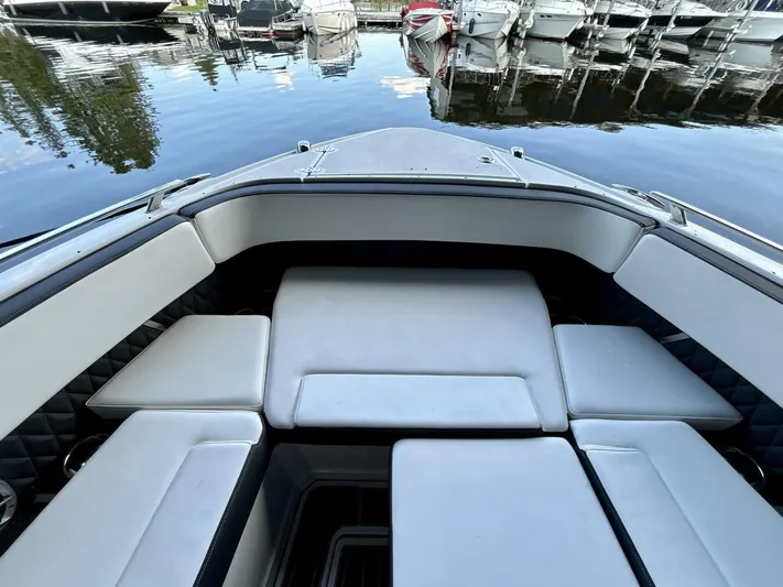  Yacht Photos Pics 2017 Monterey 378 Super Express boat interior with white seating at a marina.
