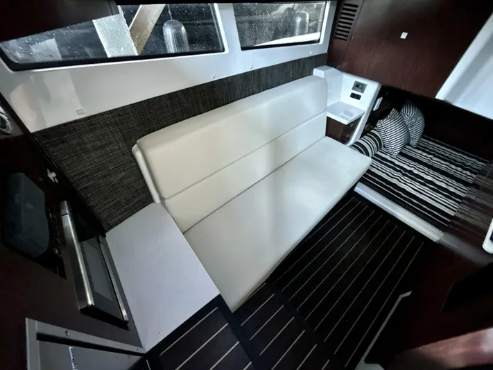  Yacht Photos Pics Interior of 2017 Monterey 378 Super Express with modern seating and striped bedding.