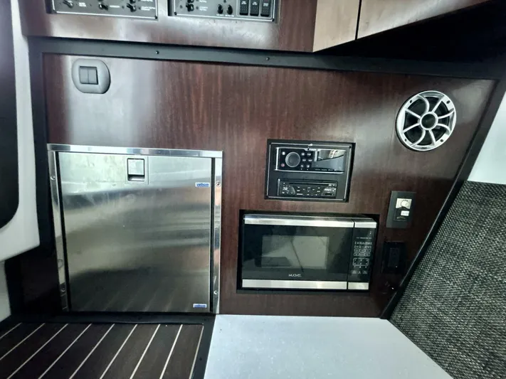  Yacht Photos Pics Interior of 2017 Monterey 378 Super Express with microwave, fridge, and audio system.