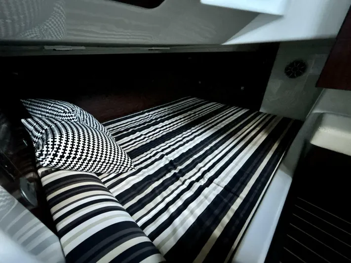  Yacht Photos Pics Interior cabin of 2017 Monterey 378 Super Express with striped bedding and pillows.