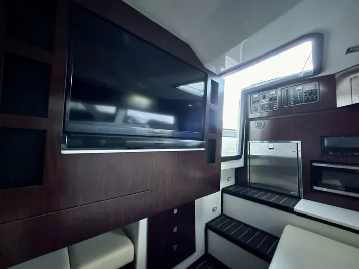  Yacht Photos Pics Interior of 2017 Monterey 378 Super Express yacht with TV and modern cabinetry.