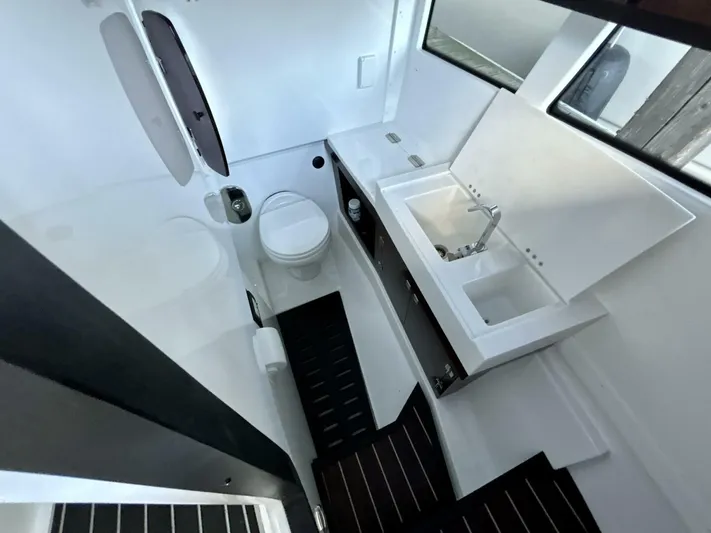  Yacht Photos Pics 2017 Monterey 378 Super Express bathroom with modern sink, toilet, and sleek design.