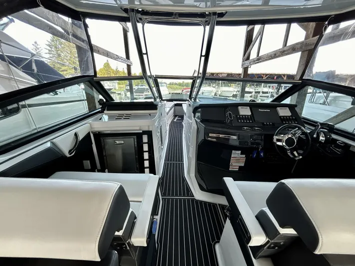  Yacht Photos Pics Interior of a 2017 Monterey 378 Super Express boat with modern dashboard and seating.