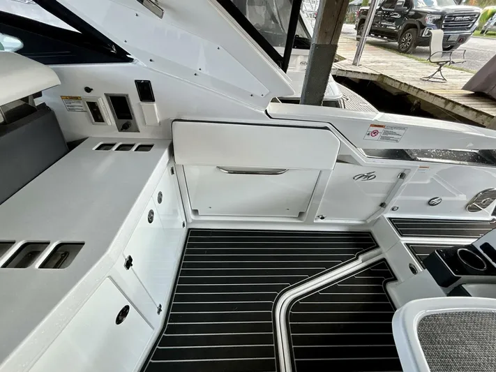  Yacht Photos Pics Interior view of a 2017 Monterey 378 Super Express boat with sleek white cabinetry.