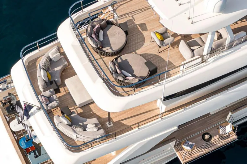  Yacht Photos Pics Luxurious 2018 Customline Navetta 33 yacht deck with elegant seating and ocean view.