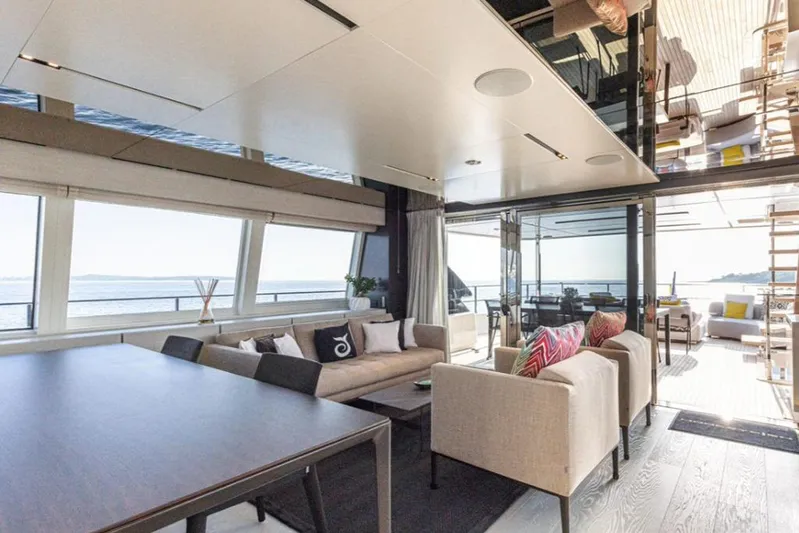  Yacht Photos Pics Luxurious interior of 2018 Customline Navetta 33 yacht with ocean view and modern furnishings.