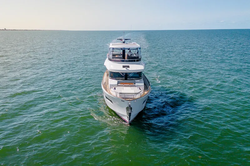 Viakarey Yacht Photos Pics 2023 Sirena 58 yacht cruising on open sea, showcasing sleek design and luxury features.