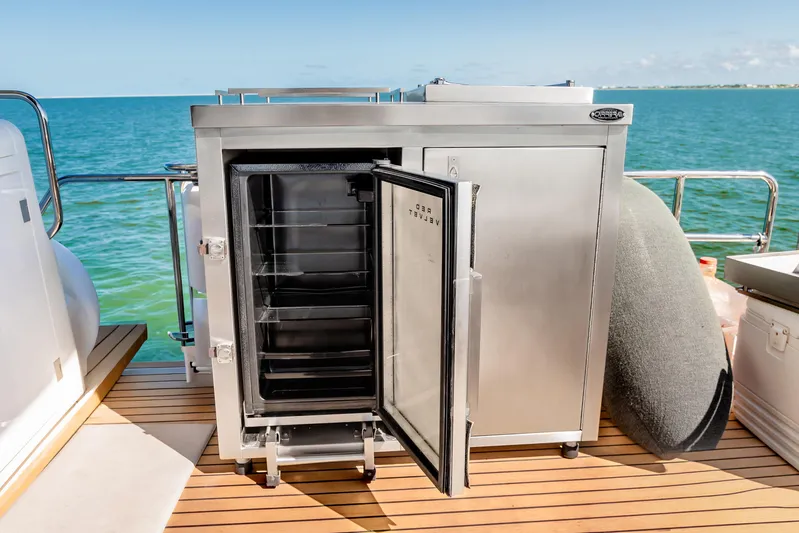 Viakarey Yacht Photos Pics Stainless steel refrigerator on Sirena 58 yacht deck, 2023 model, with ocean view.