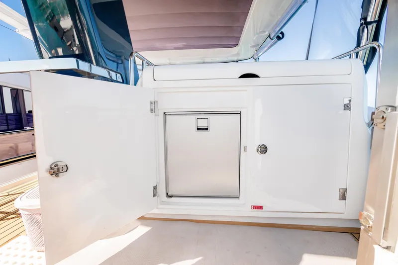 Viakarey Yacht Photos Pics Open storage compartment on 2023 Sirena 58 yacht, showcasing sleek design and functionality.