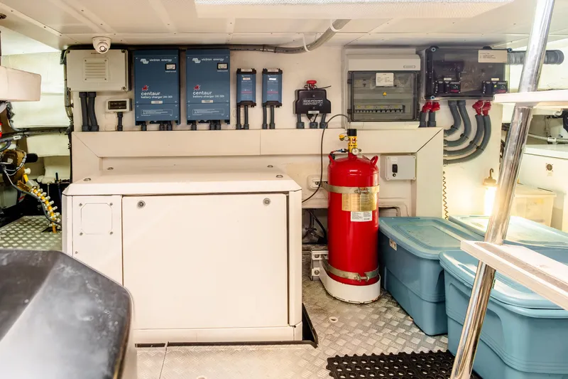 Viakarey Yacht Photos Pics Engine room of 2023 Sirena 58 yacht with equipment and storage containers.