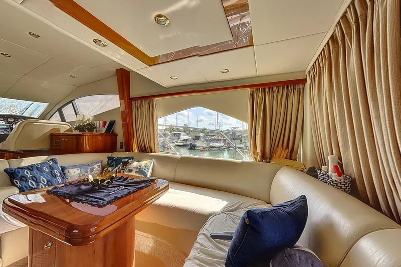  Yacht Photos Pics Luxurious interior of 2006 Sunseeker Manhattan 50 yacht with elegant seating and decor.