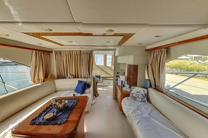  Yacht Photos Pics Luxurious interior of 2006 Sunseeker Manhattan 50 yacht with elegant seating and decor.