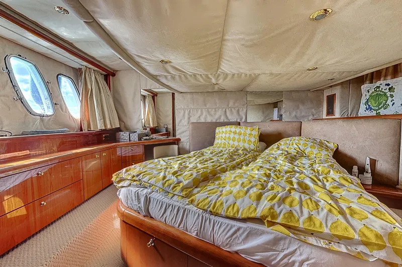  Yacht Photos Pics Luxurious cabin interior of 2006 Sunseeker Manhattan 50 yacht with cozy bedding.