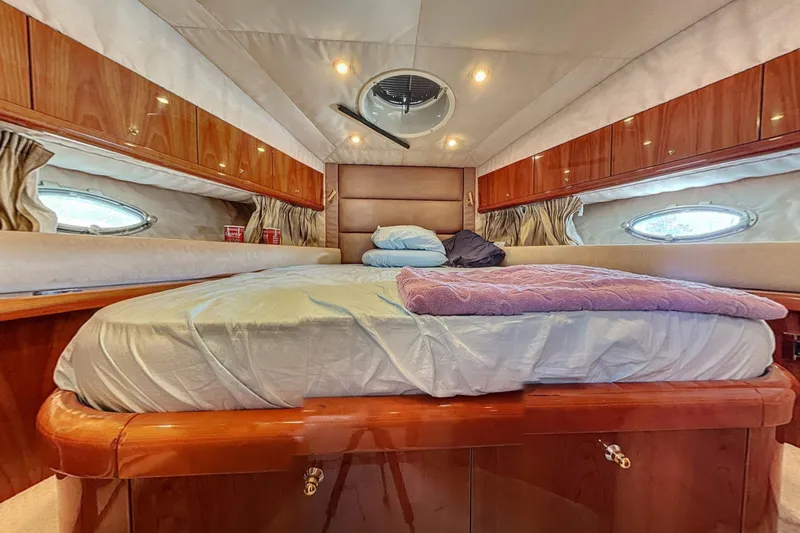  Yacht Photos Pics Luxurious cabin interior of 2006 Sunseeker Manhattan 50 yacht with cozy bedding.