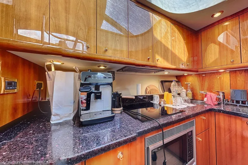  Yacht Photos Pics Luxurious kitchen interior of 2006 Sunseeker Manhattan 50 yacht with modern appliances.