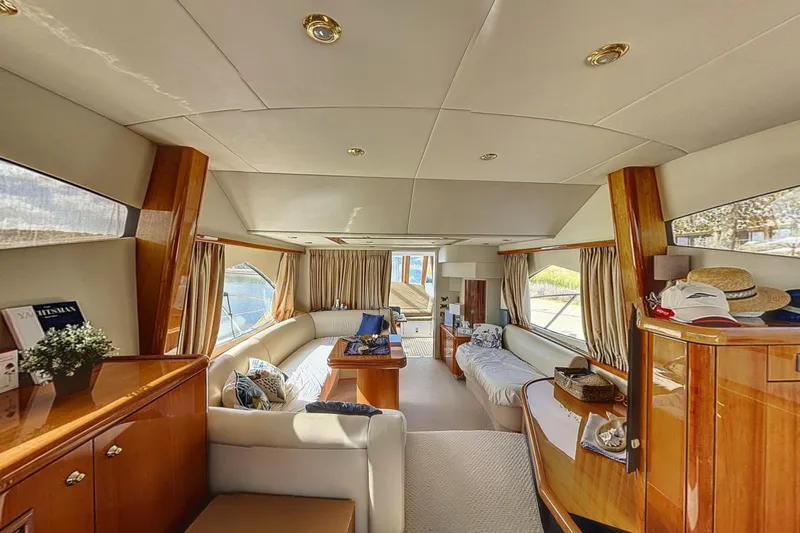  Yacht Photos Pics Luxurious interior of a 2006 Sunseeker Manhattan 50 yacht, featuring elegant wood finishes.