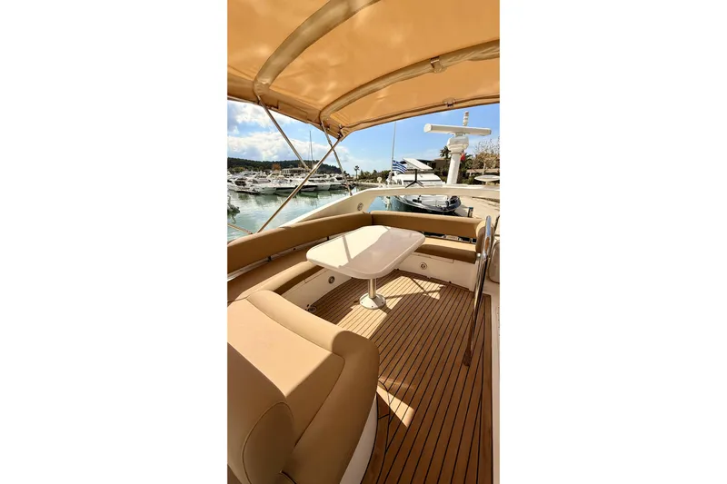  Yacht Photos Pics Luxurious Sunseeker Manhattan 50 yacht interior, 2006 model, featuring elegant seating and table.
