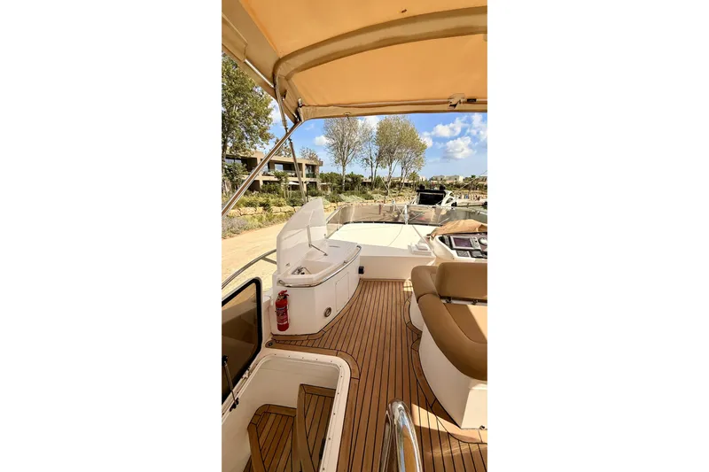  Yacht Photos Pics Luxurious 2006 Sunseeker Manhattan 50 yacht interior with teak deck and seating area.