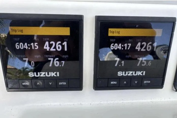  Yacht Photos Pics Dual Suzuki trip log displays on 2016 Southport 272 TE boat dashboard.
