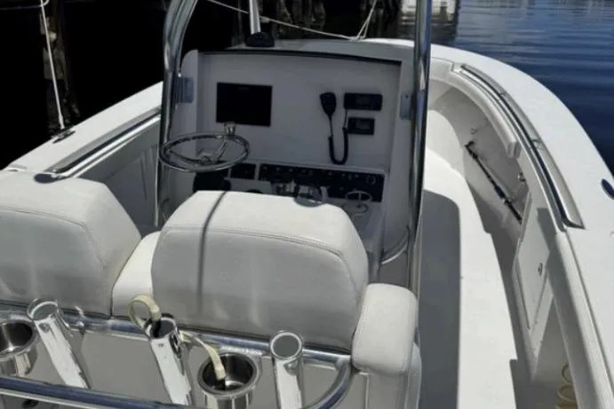  Yacht Photos Pics 2016 Southport 272 TE boat interior with helm, seating, and fishing rod holders.