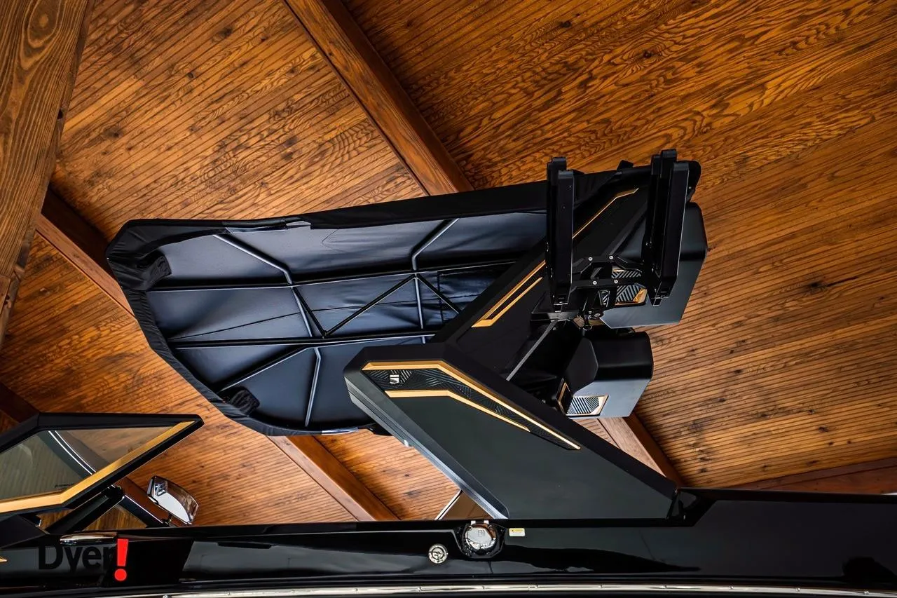 2026 MasterCraft XStar 25 boat with sleek design under wooden ceiling.