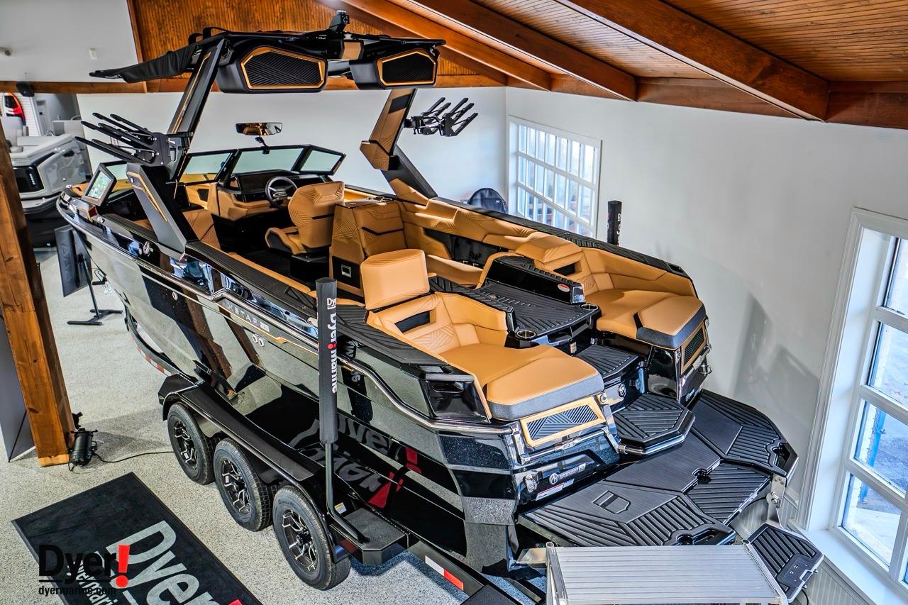 2026 MasterCraft XStar 25 boat with luxurious interior and sleek design in showroom.