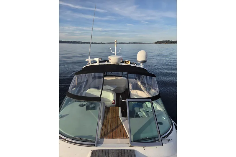  Yacht Photos Pics 2005 Formula 400 Super Sport boat on calm water, featuring sleek design and spacious deck.