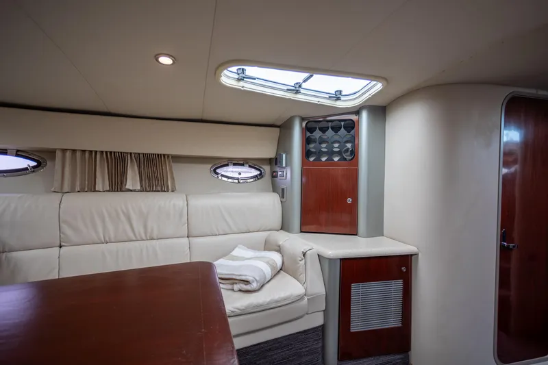  Yacht Photos Pics Luxurious interior of a 2005 Formula 400 Super Sport yacht with plush seating and elegant wood finishes.