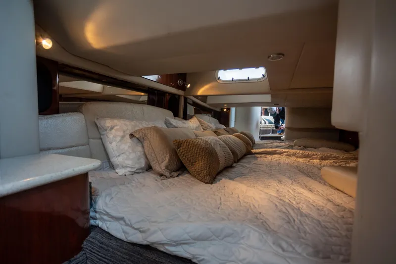  Yacht Photos Pics Luxurious cabin interior of a 2005 Formula 400 Super Sport yacht with cozy bedding.