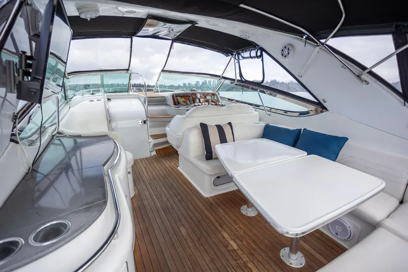  Yacht Photos Pics Luxurious interior of a 2005 Formula 400 Super Sport yacht with seating and tables.