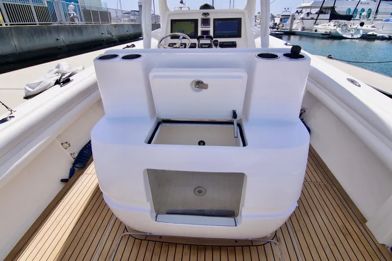  Yacht Photos Pics 2013 Intrepid Center Console boat interior with helm and storage compartments.