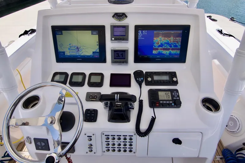  Yacht Photos Pics 2013 Intrepid Center Console boat dashboard with navigation screens and controls.