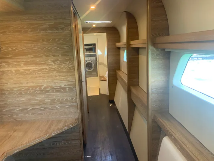 Vanquish Yacht Photos Pics Luxurious interior of 2018 Xquisite Yachts X5 with wood finish and modern amenities.