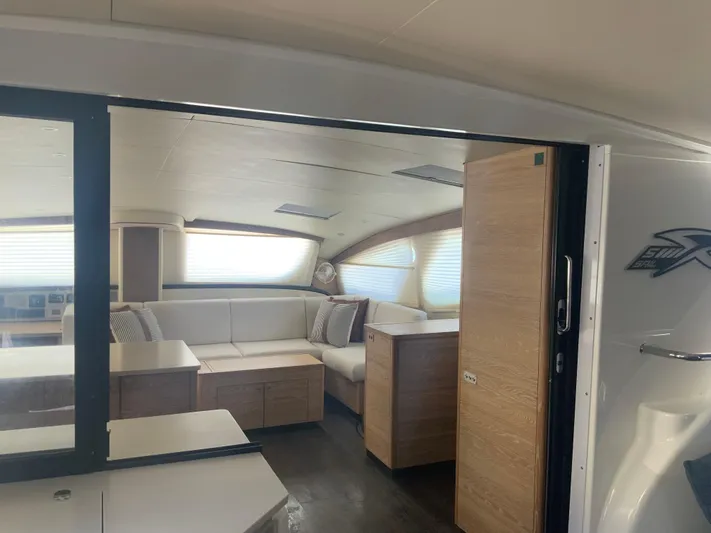 Vanquish Yacht Photos Pics Luxurious interior of 2018 Xquisite Yachts X5, featuring modern seating and elegant design.