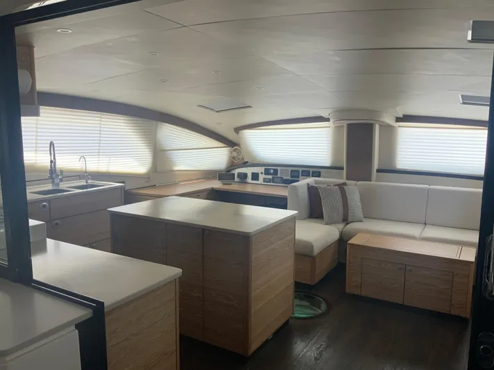 Vanquish Yacht Photos Pics Luxurious interior of 2018 Xquisite Yachts X5, featuring modern kitchen and seating area.