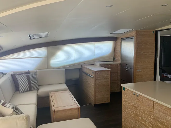 Vanquish Yacht Photos Pics Luxurious interior of 2018 Xquisite Yachts X5 with modern furnishings and ample natural light.
